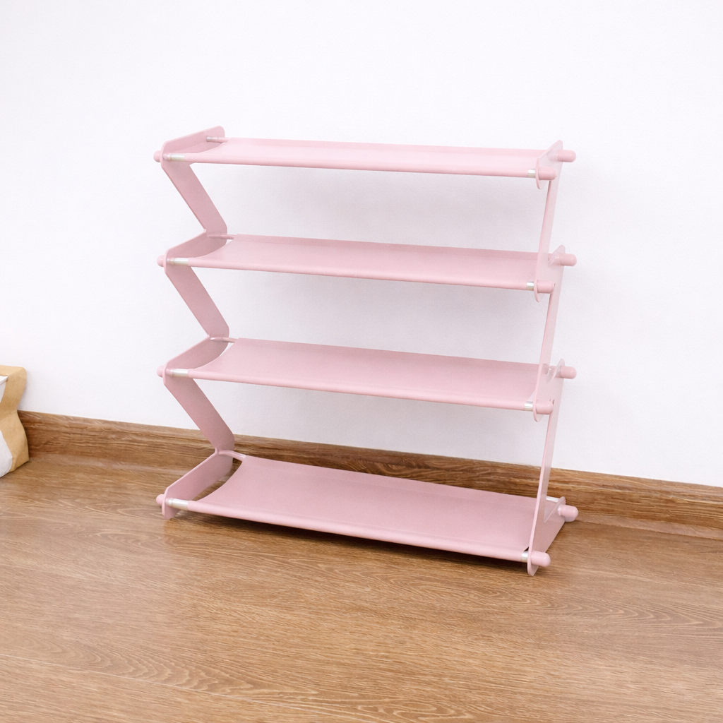 Pink shoe rack with multiple shelves on a wooden floor against a white wall.